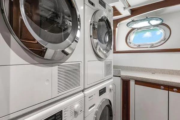 Batavia Yacht Photos Pics Laundry room on 2003 Richmond Yachts 135 Motor Yacht with stacked washers and dryers.