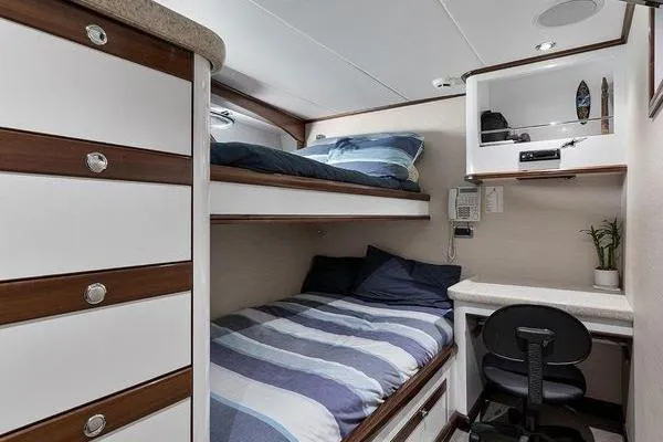 Batavia Yacht Photos Pics Cozy cabin interior of 2003 Richmond Yachts 135 Motor Yacht with bunk beds and desk.