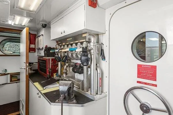 Batavia Yacht Photos Pics Engine room of 2003 Richmond Yachts 135 Motor Yacht, featuring control panels and equipment.