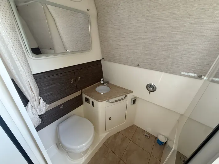  Yacht Photos Pics Bathroom interior of 2017 Boston Whaler 420 Outrage with sink and toilet.