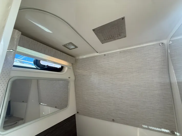  Yacht Photos Pics Interior cabin of 2017 Boston Whaler 420 Outrage, featuring window and modern design.