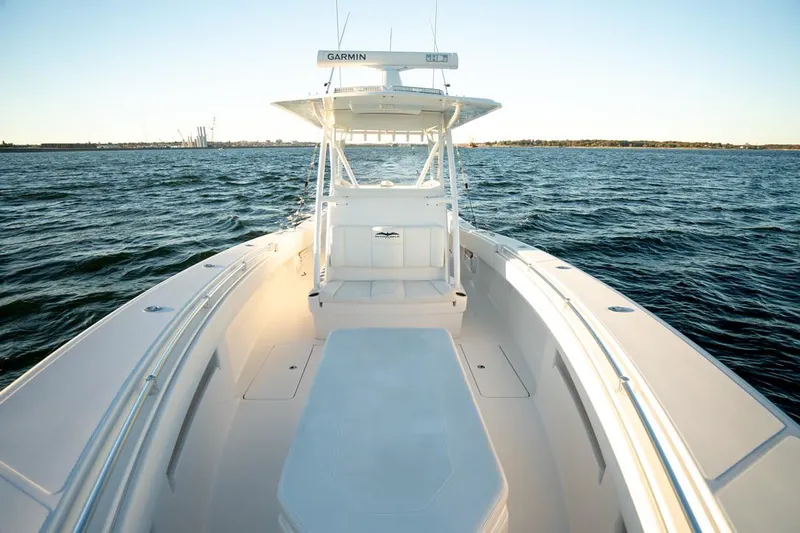 End Game Yacht Photos Pics 2020 Invincible 36 CC boat on open water, featuring spacious deck and Garmin equipment.