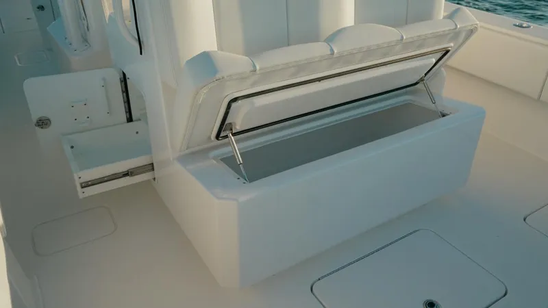 End Game Yacht Photos Pics Open storage compartment on 2020 Invincible 36 CC boat, showcasing spacious interior design.