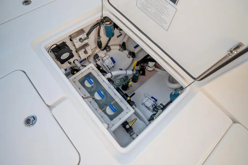 End Game Yacht Photos Pics 2020 Invincible 36 CC boat compartment with electrical and plumbing components.