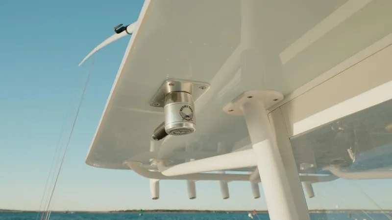 End Game Yacht Photos Pics 2020 Invincible 36 CC boat detail with mounted equipment under canopy, ocean background.