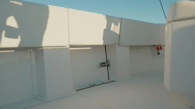 End Game Yacht Photos Pics 2020 Invincible 36 CC boat interior with white seating and clear sky.