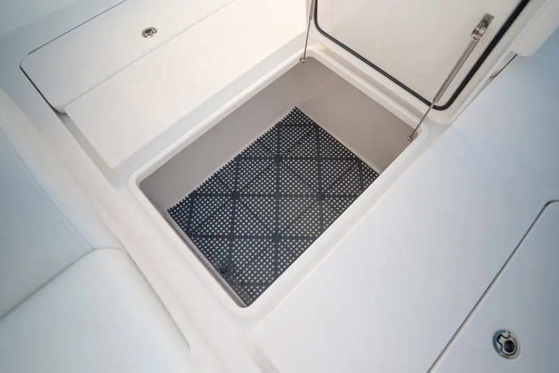 End Game Yacht Photos Pics Storage compartment on 2020 Invincible 36 CC boat with non-slip mat.