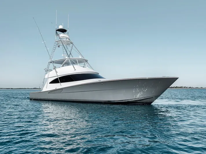 Bid Time Yacht Photos Pics 2023 Viking 72 Convertible yacht on calm blue water.