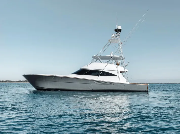 Bid Time Yacht Photos Pics 2023 Viking 72 Convertible yacht on calm blue water.