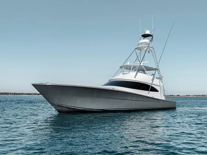 Bid Time Yacht Photos Pics 2023 Viking 72 Convertible yacht on calm blue water.