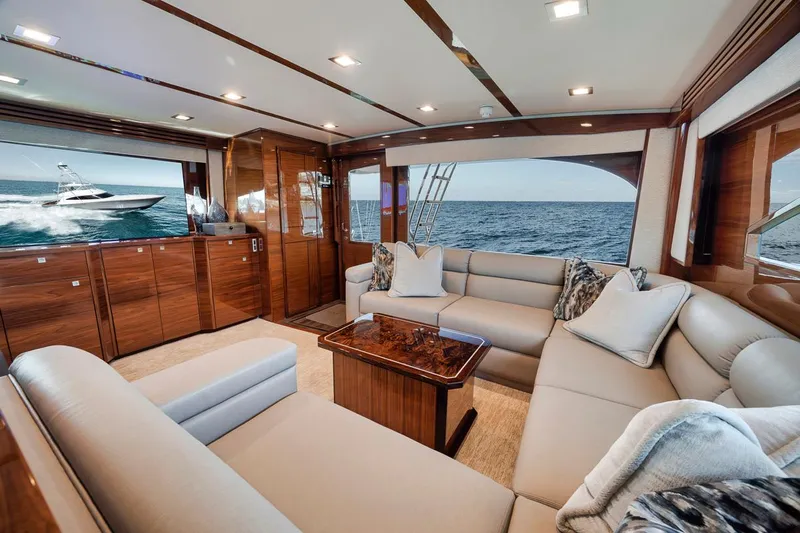 Bid Time Yacht Photos Pics Luxurious interior of 2023 Viking 72 Convertible yacht with ocean view.