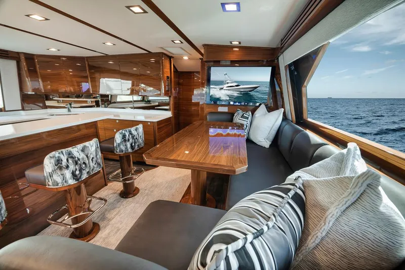 Bid Time Yacht Photos Pics Luxurious interior of 2023 Viking 72 Convertible yacht with ocean view.