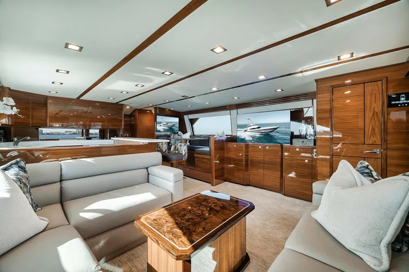 Bid Time Yacht Photos Pics Luxurious interior of 2023 Viking 72 Convertible yacht with elegant wood finishes.