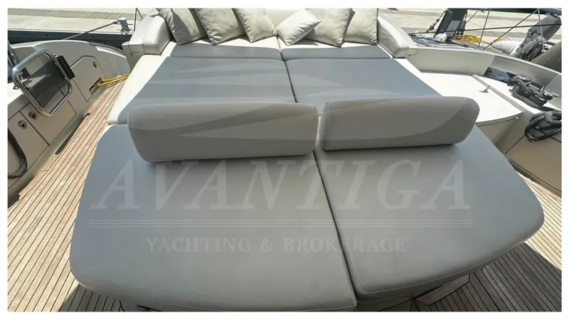  Yacht Photos Pics Luxurious sunbathing area on 2009 Azimut 68S yacht with cushioned seating.