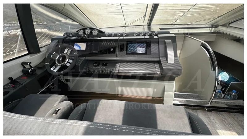  Yacht Photos Pics 2009 Azimut 68S yacht helm with modern controls and navigation displays.