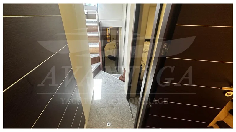  Yacht Photos Pics Interior hallway of 2009 Azimut 68S yacht with modern design and wooden stairs.