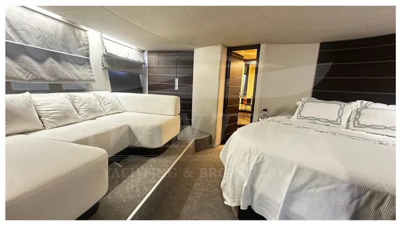 Yacht Photos Pics Luxurious interior of 2009 Azimut 68S yacht with elegant bedroom and seating area.