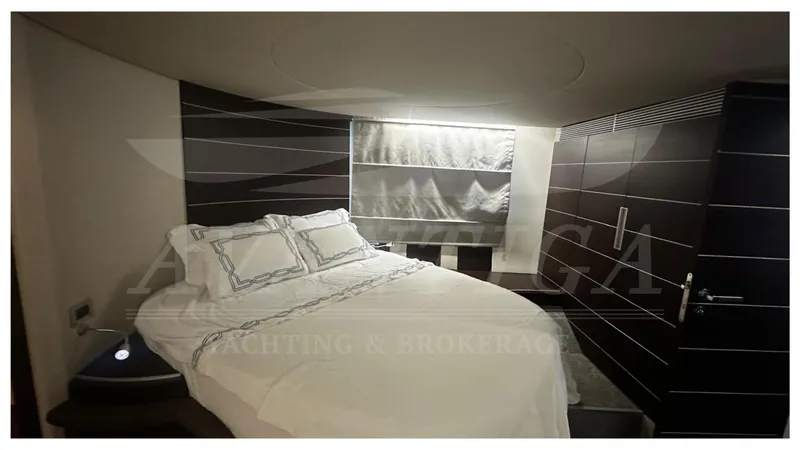  Yacht Photos Pics Luxurious bedroom interior of 2009 Azimut 68S yacht with modern design and cozy bedding.