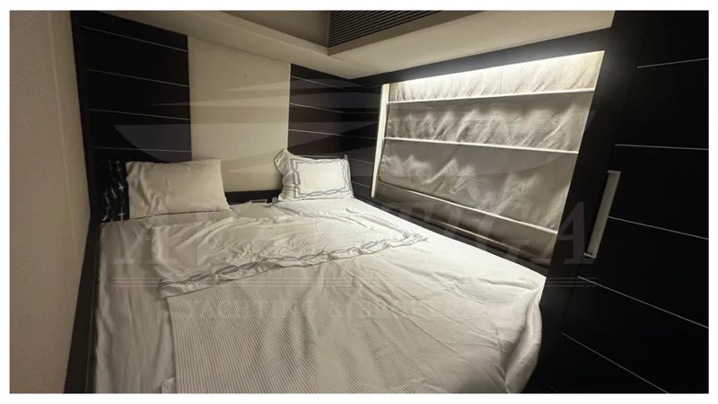  Yacht Photos Pics Luxurious bedroom interior of 2009 Azimut 68S yacht with elegant bedding and modern design.