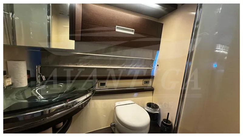  Yacht Photos Pics Luxurious bathroom interior of 2009 Azimut 68S yacht with modern fixtures and elegant design.