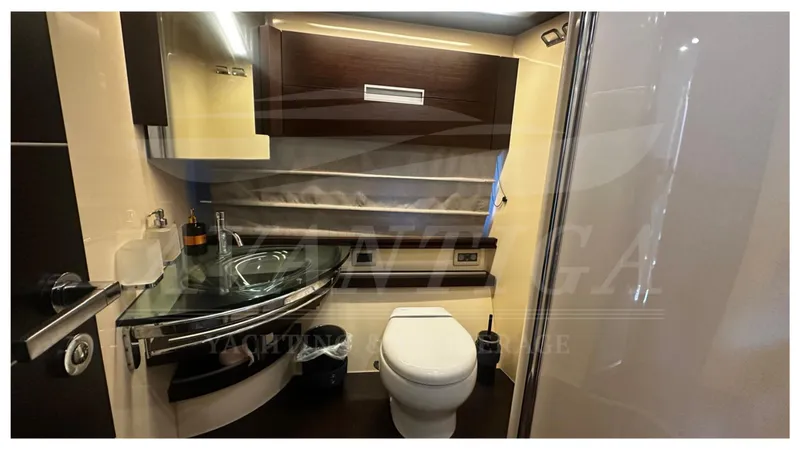  Yacht Photos Pics Luxurious bathroom interior of 2009 Azimut 68S yacht with modern fixtures and elegant design.