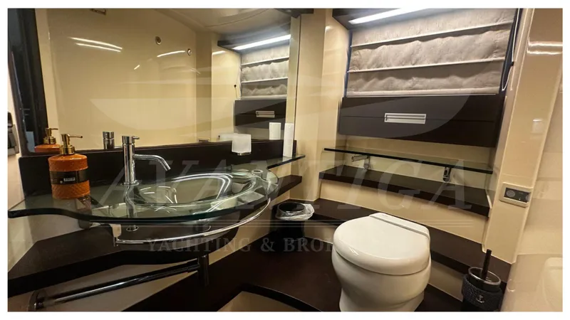  Yacht Photos Pics Luxurious bathroom interior of 2009 Azimut 68S yacht with modern fixtures and elegant design.