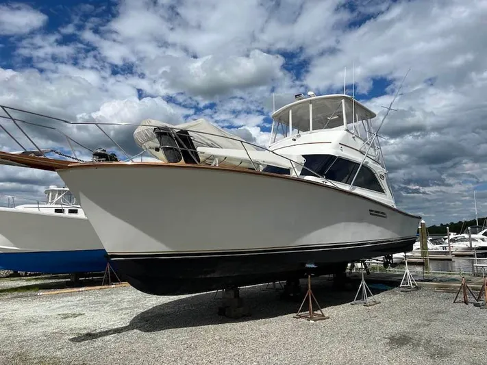  Yacht Photos Pics 1989 Ocean Yachts 44 Super Sport Custom boat on stands under cloudy sky.