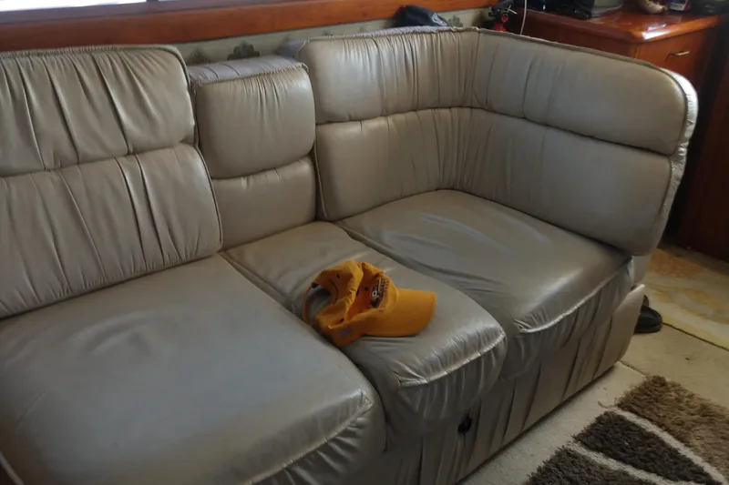  Yacht Photos Pics Beige leather sofa inside 1989 Ocean Yachts 44 Super Sport Custom, with a yellow cap on it.