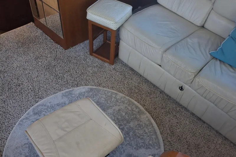  Yacht Photos Pics Interior of 1989 Ocean Yachts 44 Super Sport Custom with beige sofa and carpet.