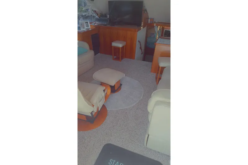  Yacht Photos Pics Interior of 1989 Ocean Yachts 44 Super Sport Custom, featuring cozy seating and a TV.