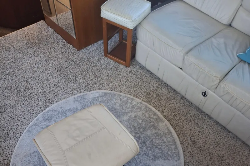 Yacht Photos Pics Interior of 1989 Ocean Yachts 44 Super Sport Custom with beige sofa and carpet.