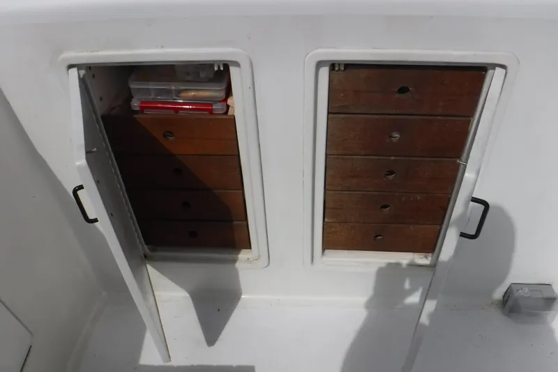  Yacht Photos Pics Storage compartments on 1989 Ocean Yachts 44 Super Sport Custom boat with wooden drawers.