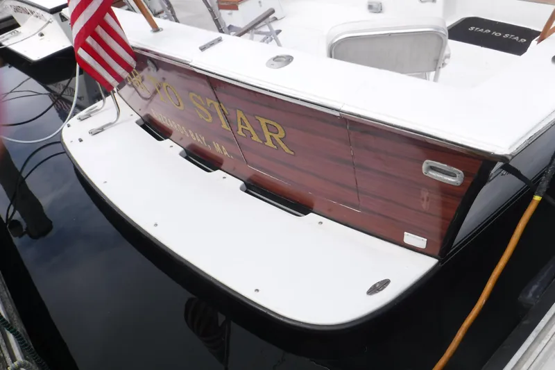  Yacht Photos Pics 1989 Ocean Yachts 44 Super Sport Custom docked, featuring wooden transom and American flag.