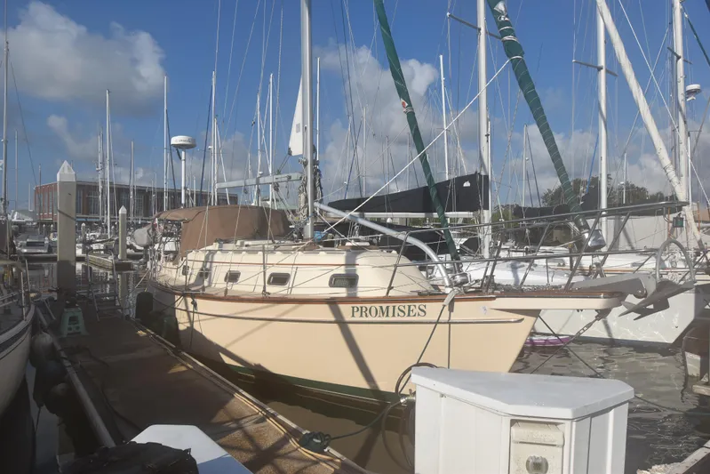 Promises Yacht Photos Pics Island Packet 350 sailboat docked at marina, 1998 model, named "Promises."
