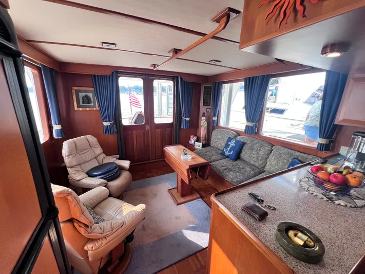 Xanadu Yacht Photos Pics Luxurious 2006 DeFever Pilothouse interior with cozy seating and elegant decor.