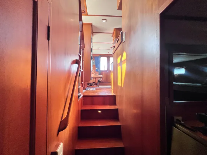 Xanadu Yacht Photos Pics 2006 DeFever Pilothouse interior with wooden stairs and natural light.