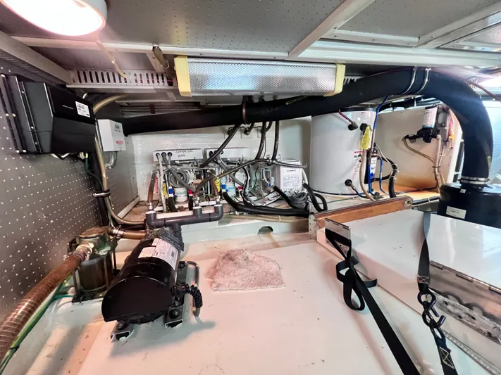 Xanadu Yacht Photos Pics Engine room of 2006 DeFever Pilothouse with mechanical components and wiring.