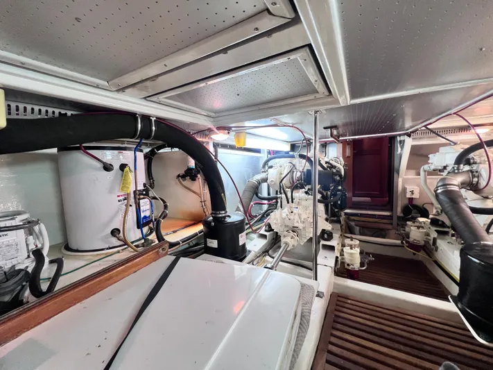 Xanadu Yacht Photos Pics Engine room of 2006 DeFever Pilothouse yacht, showcasing mechanical components and systems.
