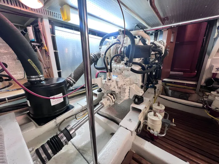 Xanadu Yacht Photos Pics Engine room of 2006 DeFever Pilothouse yacht, showcasing mechanical components and systems.