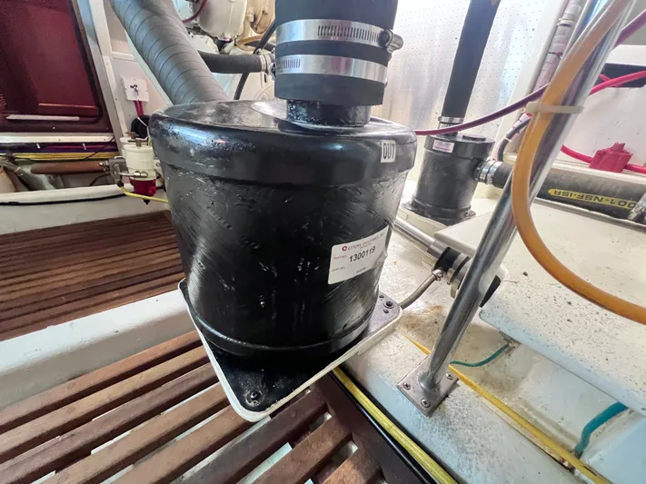 Xanadu Yacht Photos Pics Engine room of 2006 DeFever Pilothouse with mechanical components and hoses.