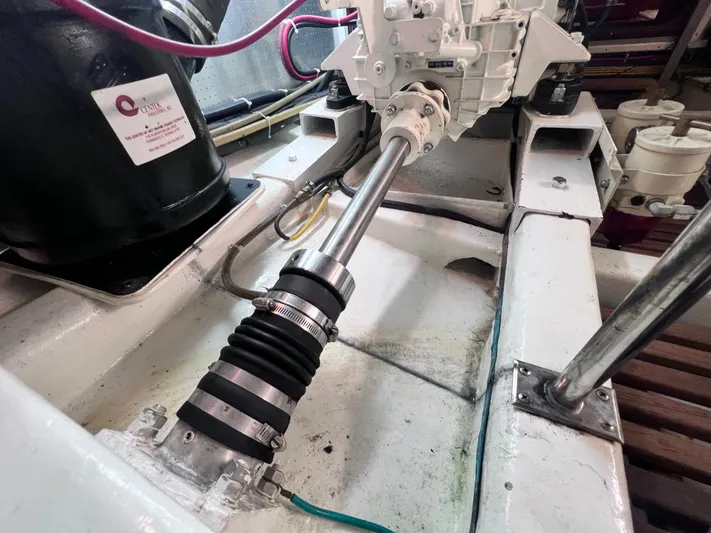 Xanadu Yacht Photos Pics Engine room of 2006 DeFever Pilothouse, showcasing mechanical components and shaft assembly.