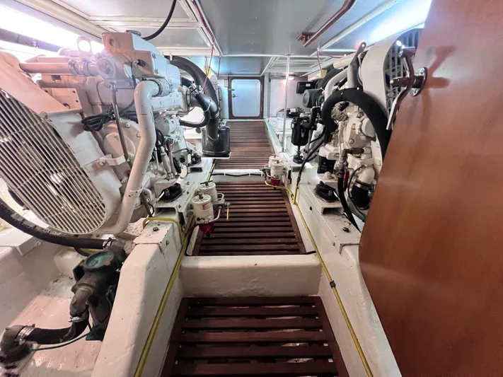 Xanadu Yacht Photos Pics Engine room of 2006 DeFever Pilothouse yacht with visible machinery and equipment.