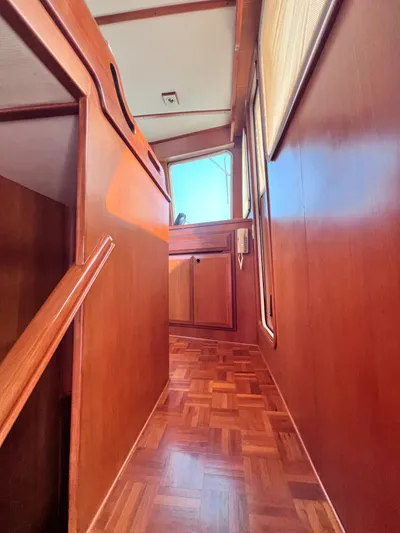 Xanadu Yacht Photos Pics 2006 DeFever Pilothouse interior with wooden paneling and flooring.