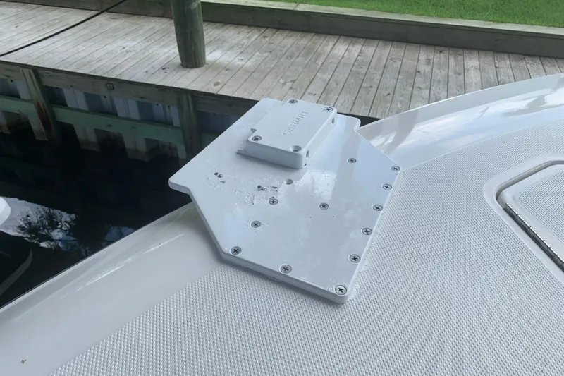  Yacht Photos Pics Invincible 36 CC 2008 boat deck with mounted equipment near dock.