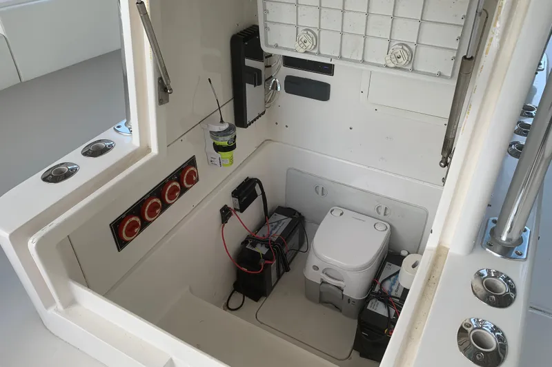  Yacht Photos Pics Interior of 2008 Invincible 36 CC boat showing equipment and compact toilet.