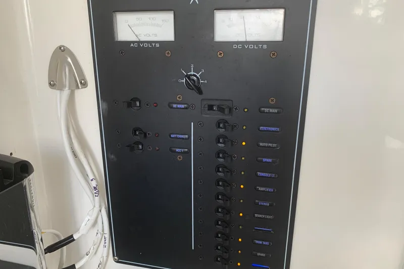  Yacht Photos Pics Electrical control panel on a 2008 Invincible 36 CC boat, showing AC and DC volt meters.