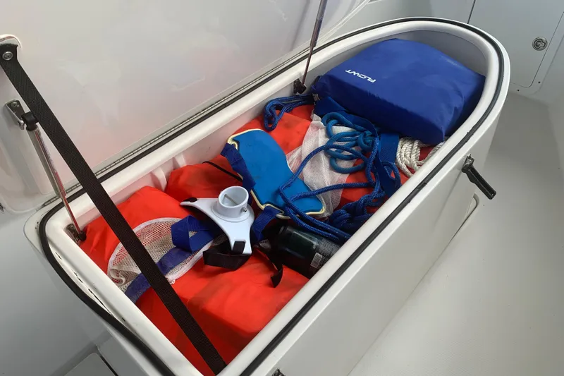  Yacht Photos Pics Storage compartment on 2008 Invincible 36 CC boat with safety gear and ropes.