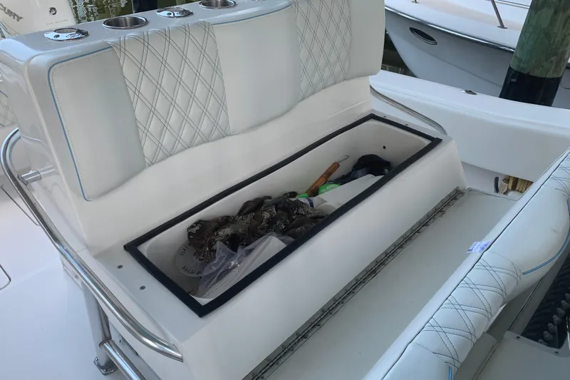  Yacht Photos Pics Storage compartment on 2008 Invincible 36 CC boat with fishing gear and accessories.
