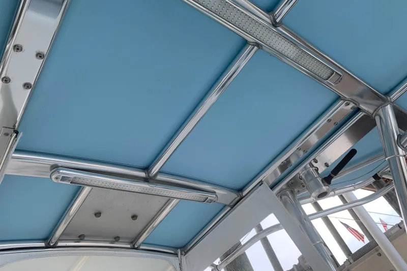  Yacht Photos Pics Blue canopy and metal framework of 2008 Invincible 36 CC boat.