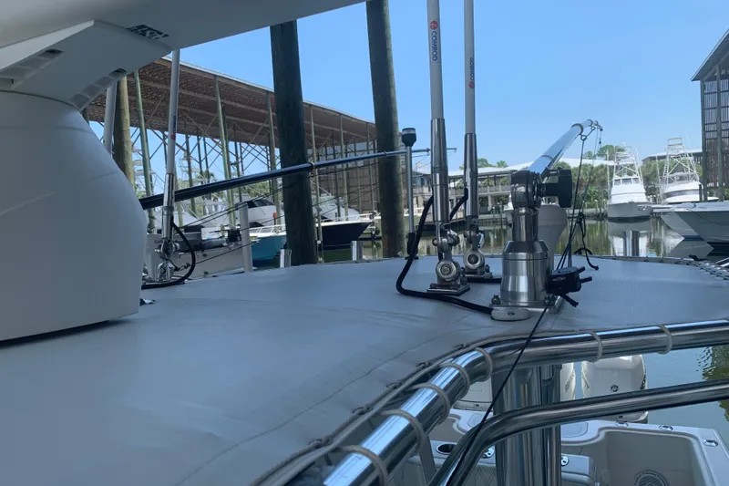  Yacht Photos Pics 2008 Invincible 36 CC boat docked, featuring antennas and equipment on deck.